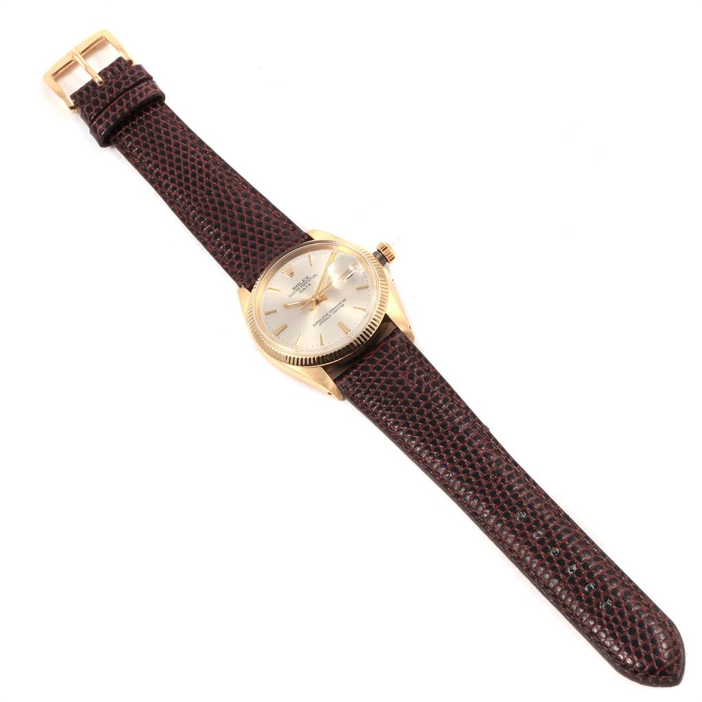 The Rolex Vintage Collection 1503 Men's Yellow Gold Silver Dial 1503 Men's Yellow Gold Silver Dial watch is shown from a slightly angled top view, displaying its face, bezel, crown, and leather strap.