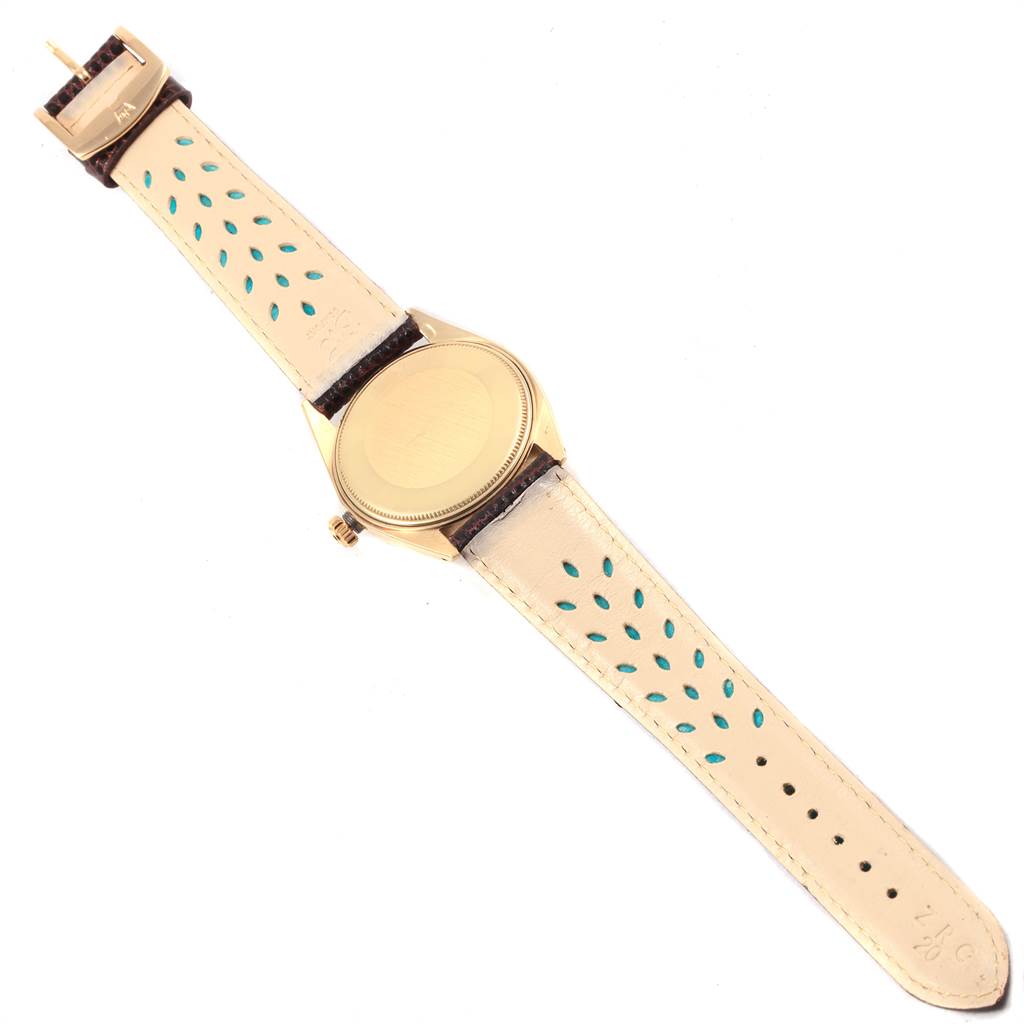 The image shows the back and inside strap of a vintage Rolex Vintage Collection 1503 Men's Yellow Gold Silver Dial 1503 Men's Yellow Gold Silver Dial model watch.