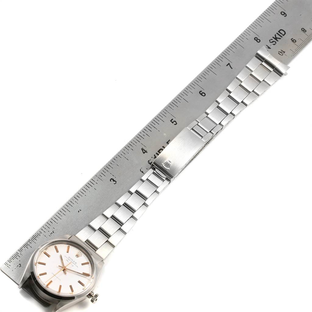 Aerial view showing the face, casing, bracelet, and clasp of the Rolex Vintage Collection 5500 Men's Stainless Steel Silver Dial 5500 Men's Stainless Steel Silver Dial watch with a ruler for scale.