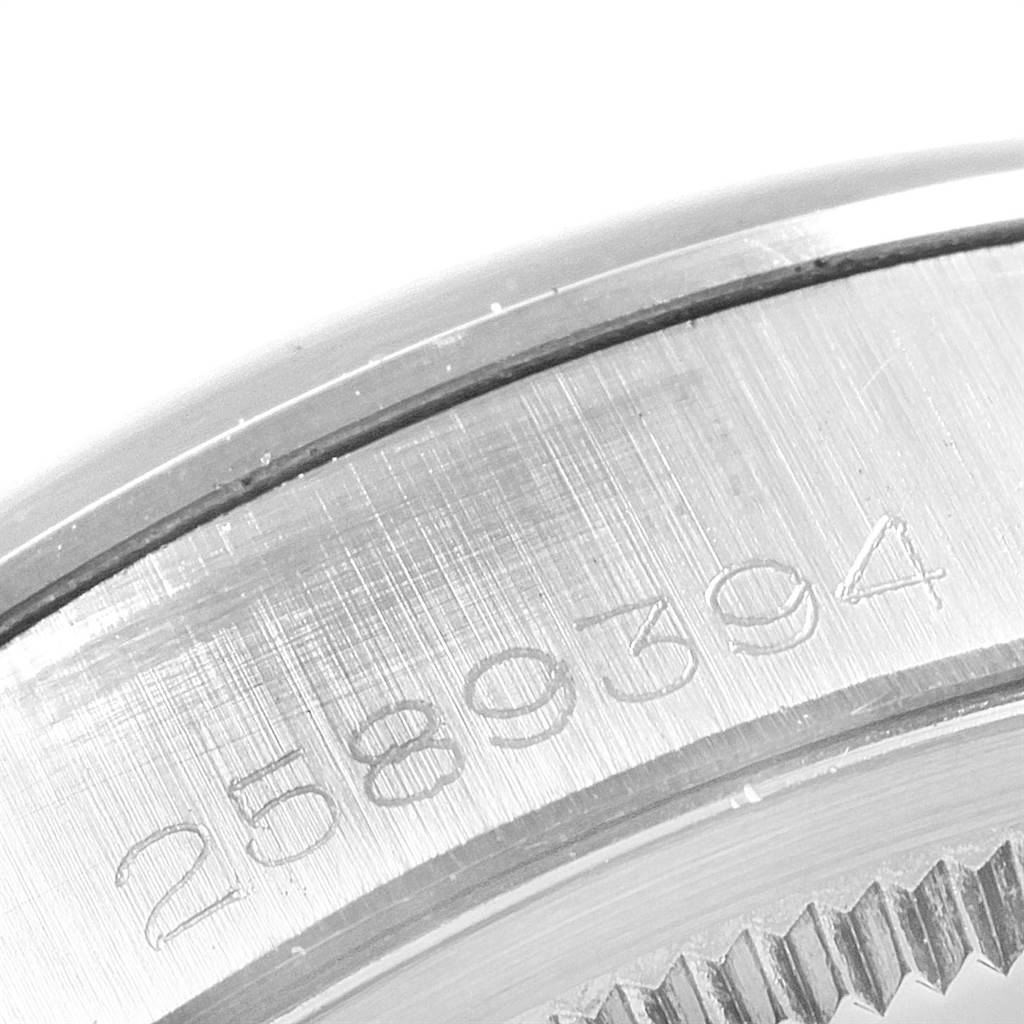 This close-up image shows the serial numbers engraved on the side of the case of a Vintage Collection Rolex watch.