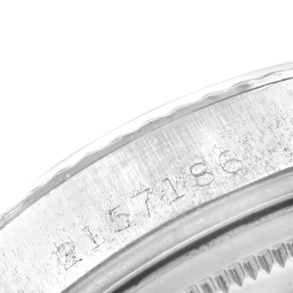 The image shows a close-up view of the engraved serial number on the caseback of a Rolex Vintage Collection 1601 Men's Stainless Steel Silver Dial 1601 Men's Stainless Steel Silver Dial watch.