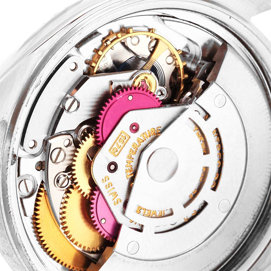 The image shows the intricate inner mechanism of the Rolex Vintage Collection 1601 Men's Stainless Steel Silver Dial 1601 Men's Stainless Steel Silver Dial watch at a close-up angle.