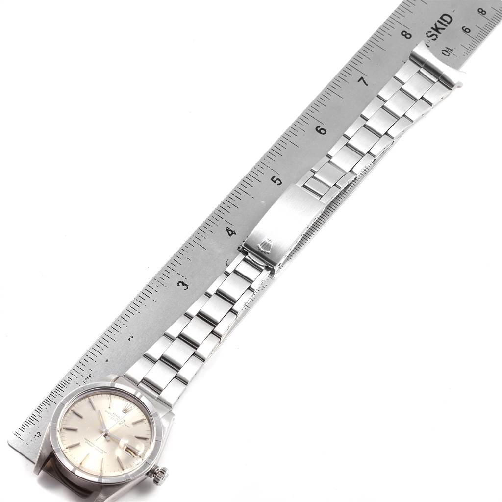 The image shows a Vintage Collection Rolex watch from a top-down angle, with a focus on the dial, bracelet, and clasp, alongside a ruler for scale.