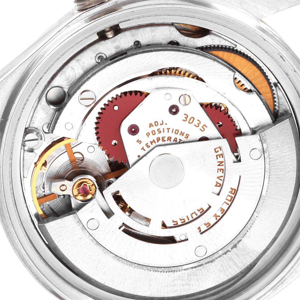 The image shows a close-up view of the movement mechanism of a Rolex Vintage Collection 16013 Men's Stainless Steel Champagne Dial 16013 Men's Stainless Steel Champagne Dial watch, highlighting gears and components.