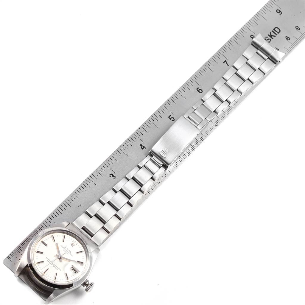 The image shows a Rolex Vintage Collection 1500 Men's Stainless Steel Silver Dial 1500 Men's Stainless Steel Silver Dial watch laid out flat next to a ruler to measure the bracelet length.