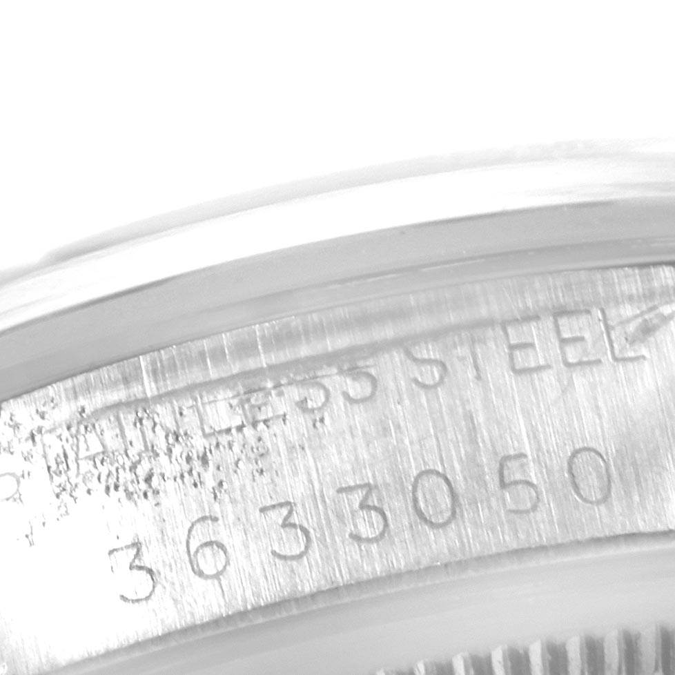 This close-up image shows the serial number and "stainless steel" marking on the case edge of a Rolex Vintage Collection 1500 Men's Stainless Steel Silver Dial 1500 Men's Stainless Steel Silver Dial watch.