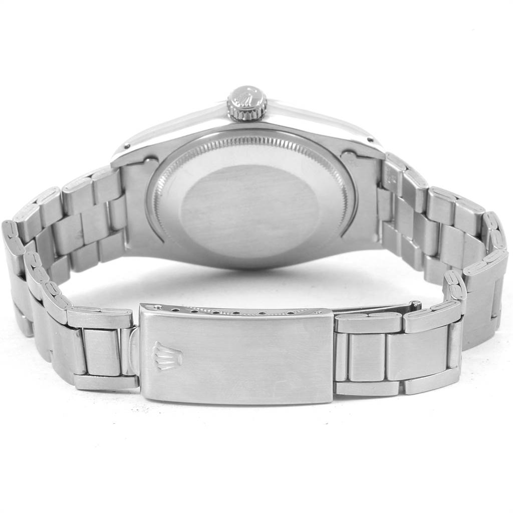 The image shows the back view of the Rolex Vintage Collection 1500 Men's Stainless Steel Silver Dial 1500 Men's Stainless Steel Silver Dial watch, highlighting the case back, bracelet, and clasp.