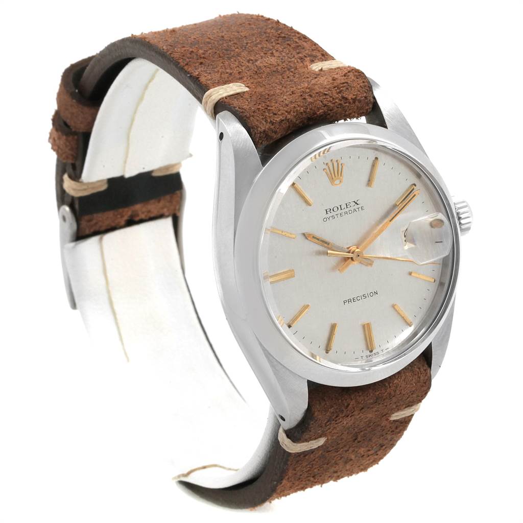 This Vintage Collection Rolex watch is shown at a three-quarter angle, displaying its face, bezel, crown, and leather strap.