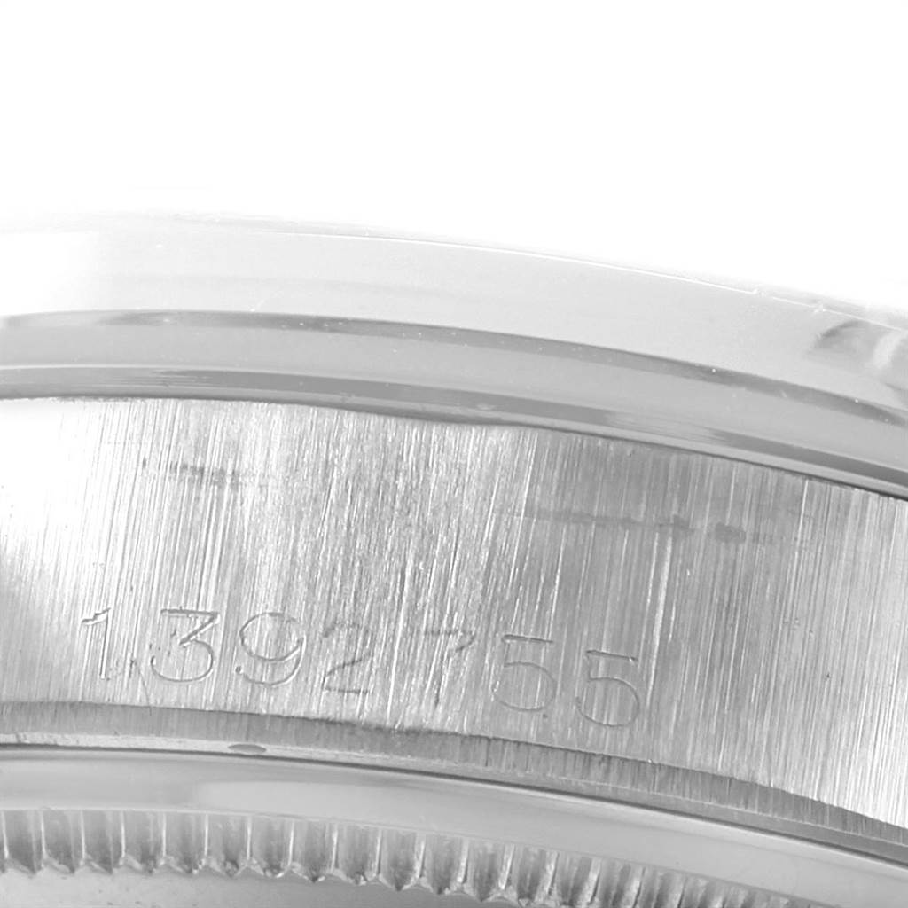 The image shows a close-up of the case back edge and serial number on a Rolex Vintage Collection 6694 Men's Stainless Steel Silver Dial 6694 Men's Stainless Steel Silver Dial model watch.