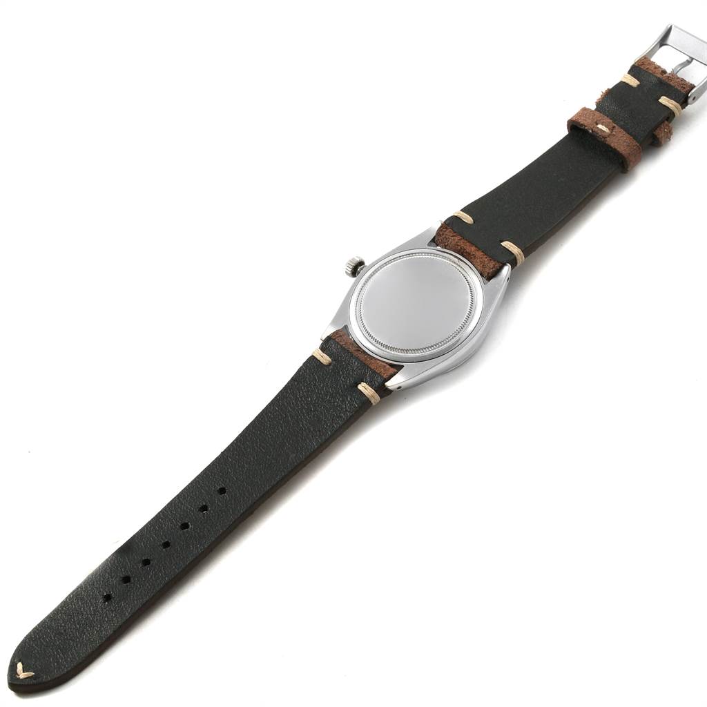 The image shows the face, bezel, and leather strap of a Rolex Vintage Collection 6694 Men's Stainless Steel Silver Dial 6694 Men's Stainless Steel Silver Dial model from a top-down angle.