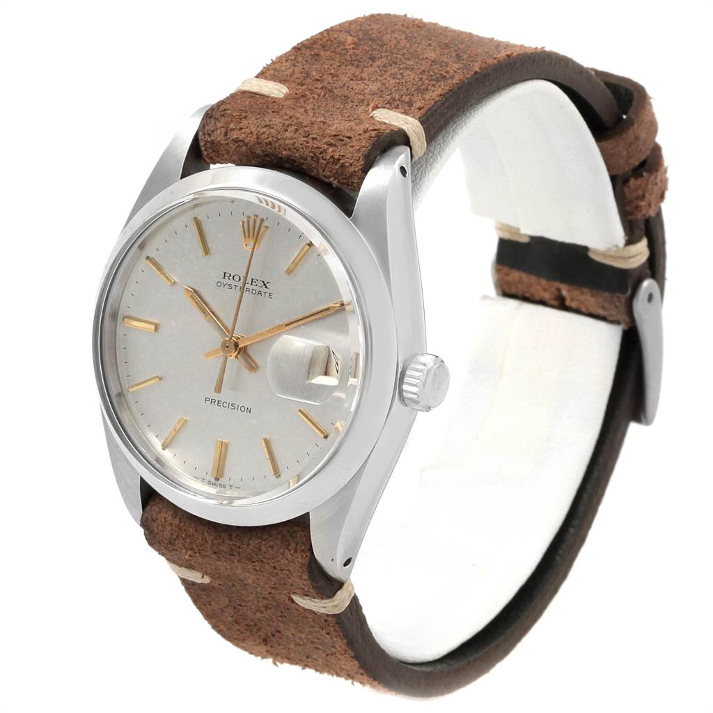 The image shows a side angle of a Rolex Vintage Collection 6694 Men's Stainless Steel Silver Dial 6694 Men's Stainless Steel Silver Dial watch, displaying the face, crown, and brown leather strap.