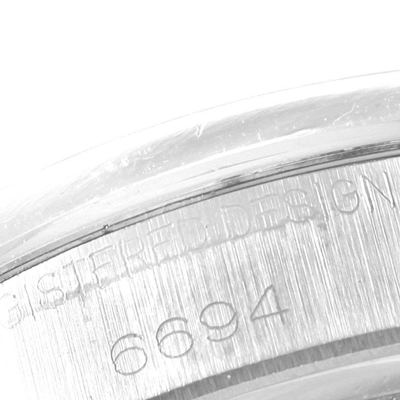 This image shows a close-up of the case back edge with part of the model number "6694" of the Vintage Collection Rolex watch.