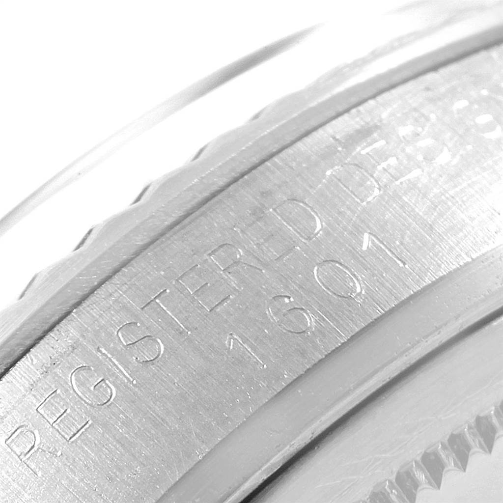 This close-up image shows the engraved edge of a Vintage Collection Rolex watch case.