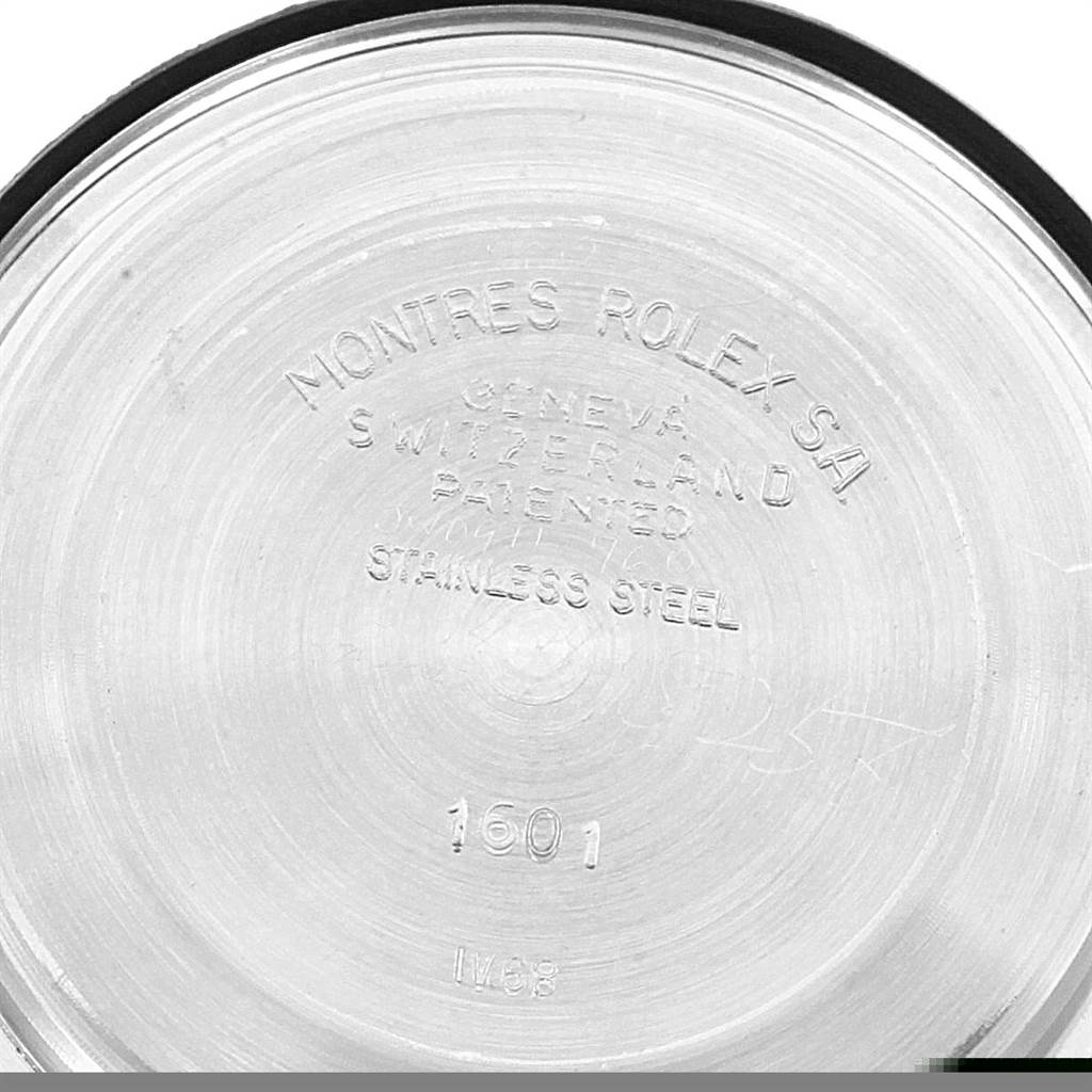 The image shows the inner side of the case back of a Rolex Vintage Collection 1601 Men's Stainless Steel Silver Dial 1601 Men's Stainless Steel Silver Dial model 1601, engraved with branding and material details.