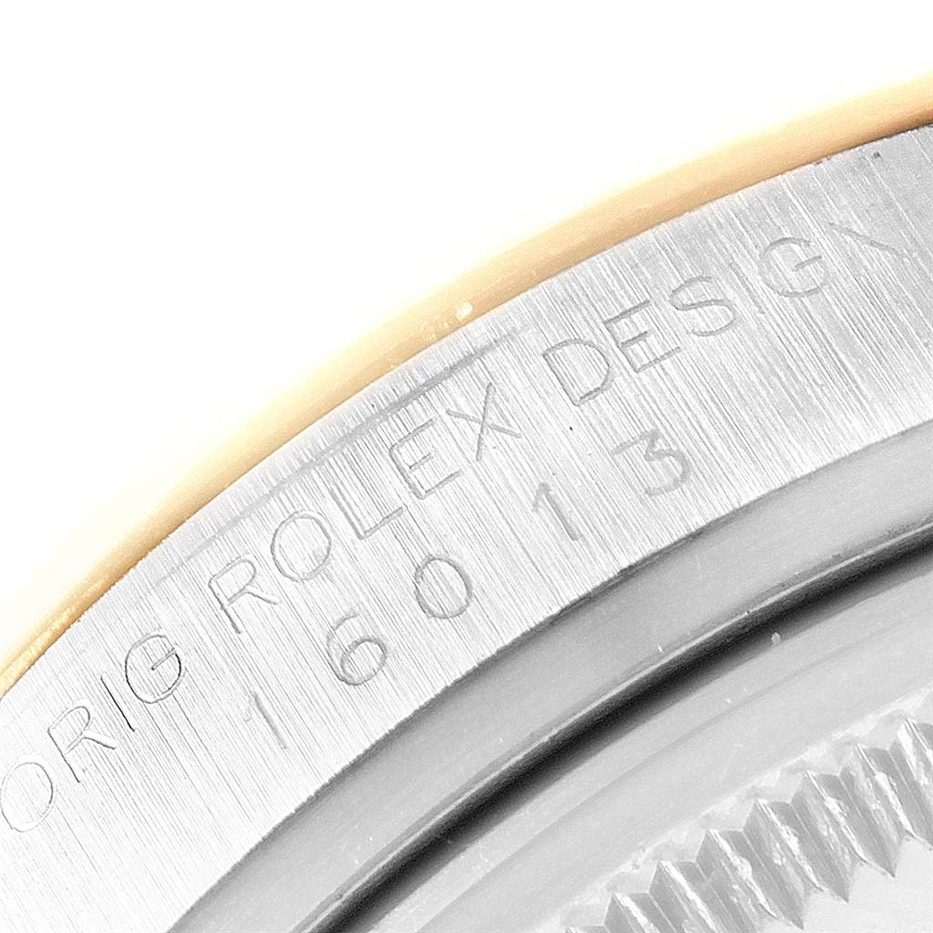 The image shows a close-up of the side of the Rolex Vintage Collection 16013 Men's Stainless Steel Black Dial 16013 Men's Stainless Steel Black Dial watch case, displaying the engraved model number and "Rolex Design" text.