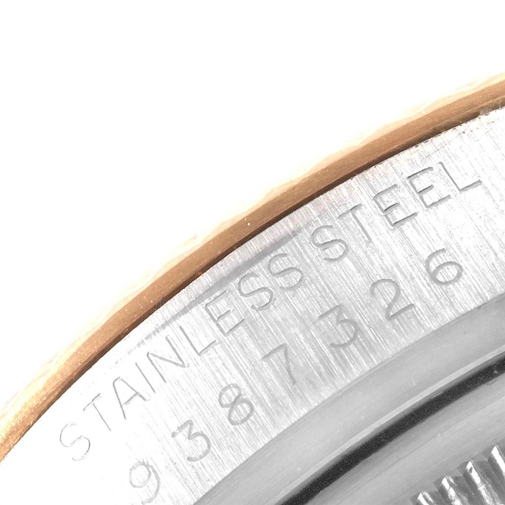 The image shows a close-up of the side of a Rolex Vintage Collection 16013 Men's Stainless Steel Black Dial 16013 Men's Stainless Steel Black Dial watch, highlighting the stainless steel engraving and part of the serial number.