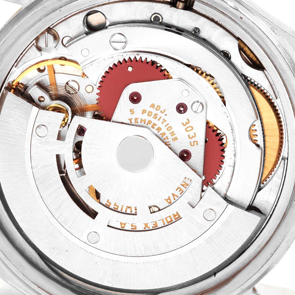 The image shows a close-up of the inner mechanical components of a Vintage Collection Rolex watch, specifically an automatic movement model 3035.