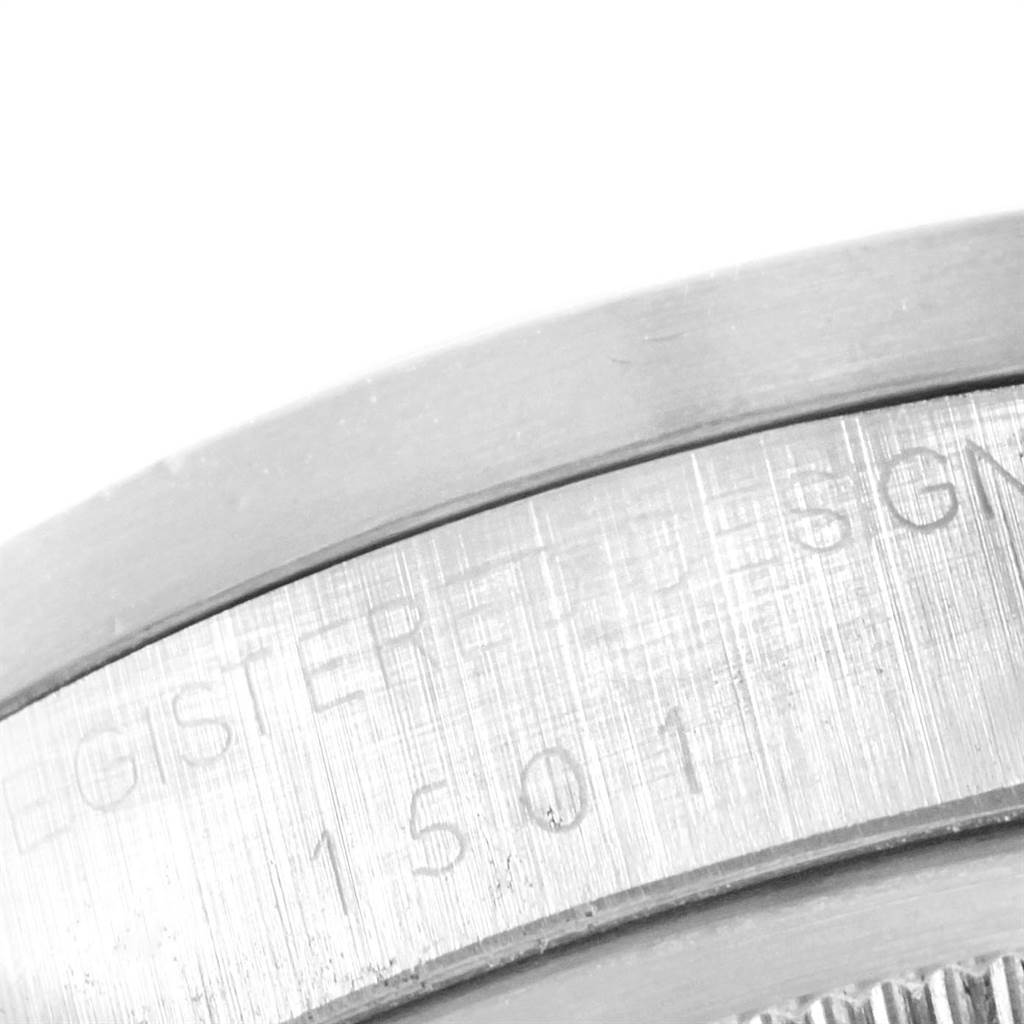 The image shows a close-up of the engraved serial number and design registration on the case of the Vintage Collection watch by Rolex.