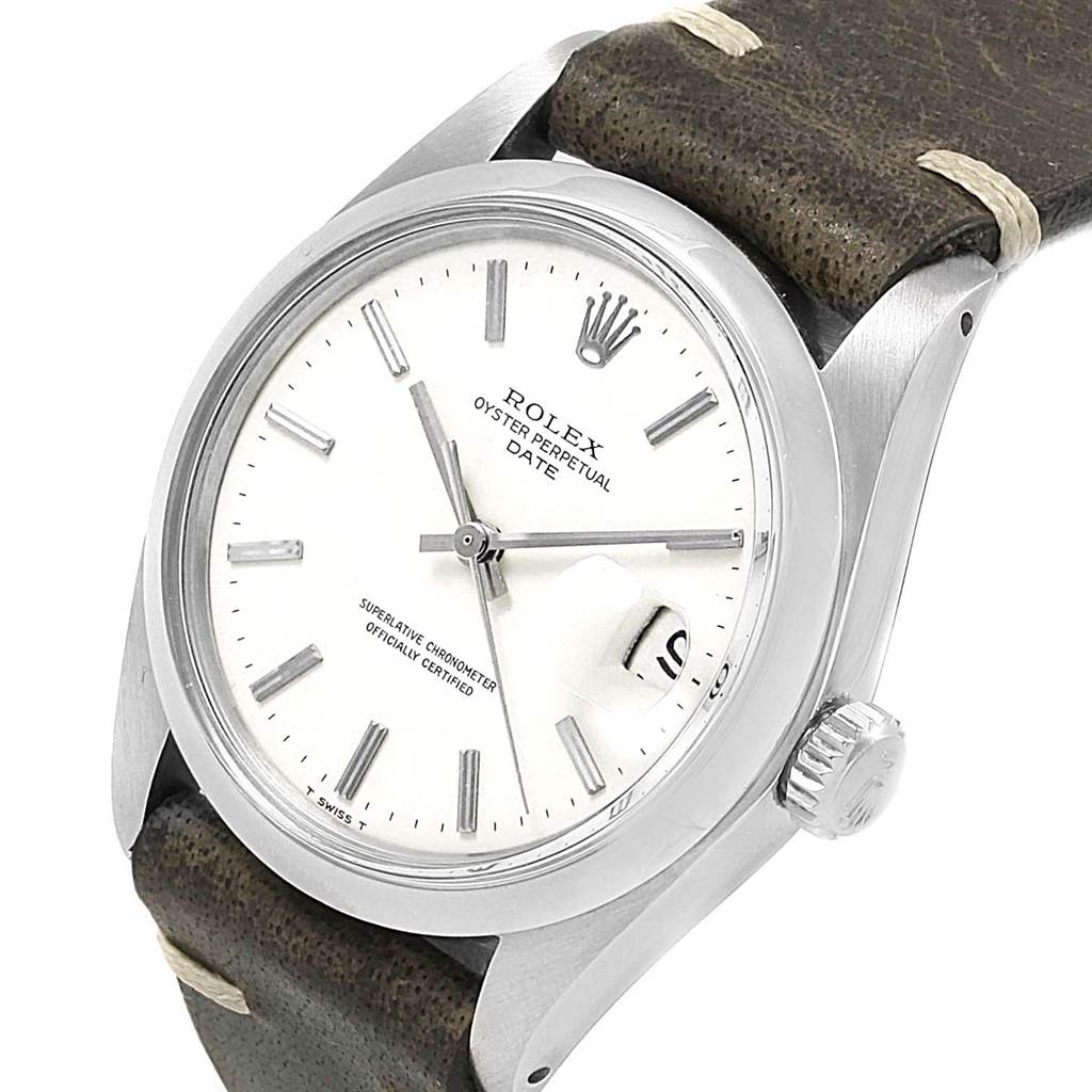 The Rolex Vintage Collection 1500 Men's Stainless Steel White Dial 1500 Men's Stainless Steel White Dial watch is shown at an angled view, highlighting its white dial, bezel, crown, and brown leather strap.