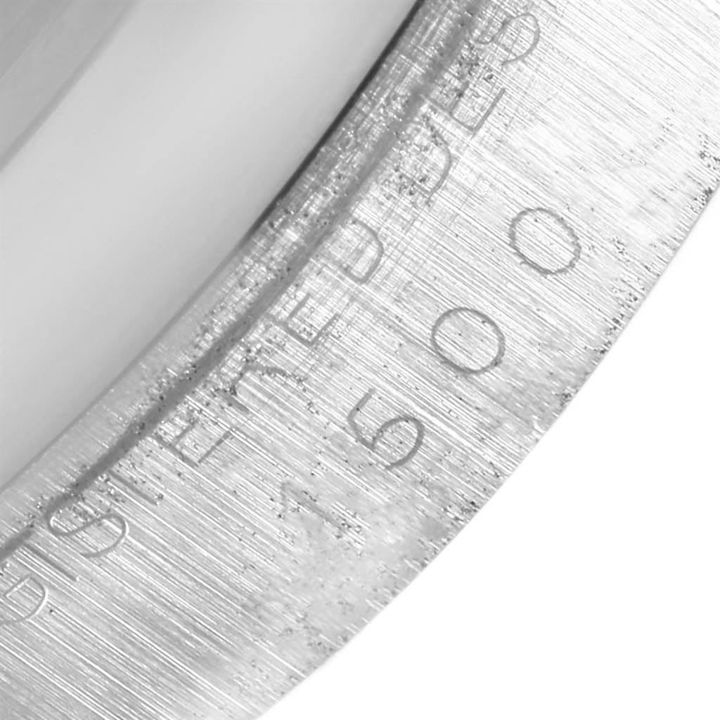 The image shows an extreme close-up of the bezel of a Rolex Vintage Collection 1500 Men's Stainless Steel White Dial 1500 Men's Stainless Steel White Dial watch.