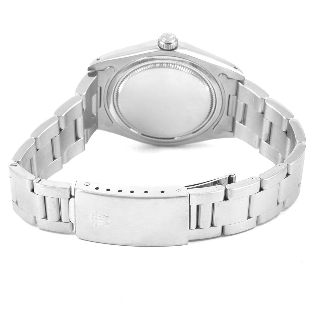 The image shows the back and bracelet of a Rolex Vintage Collection 6694 Men's Stainless Steel Black Dial 6694 Men's Stainless Steel Black Dial model watch, highlighting its clasp and crown.