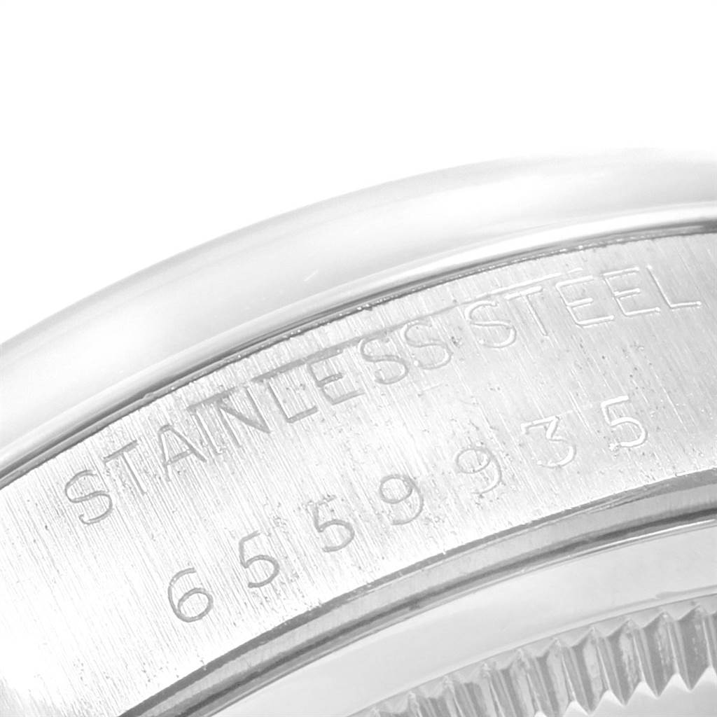 This close-up image shows the stainless steel case back and serial number of the Vintage Collection Rolex watch.