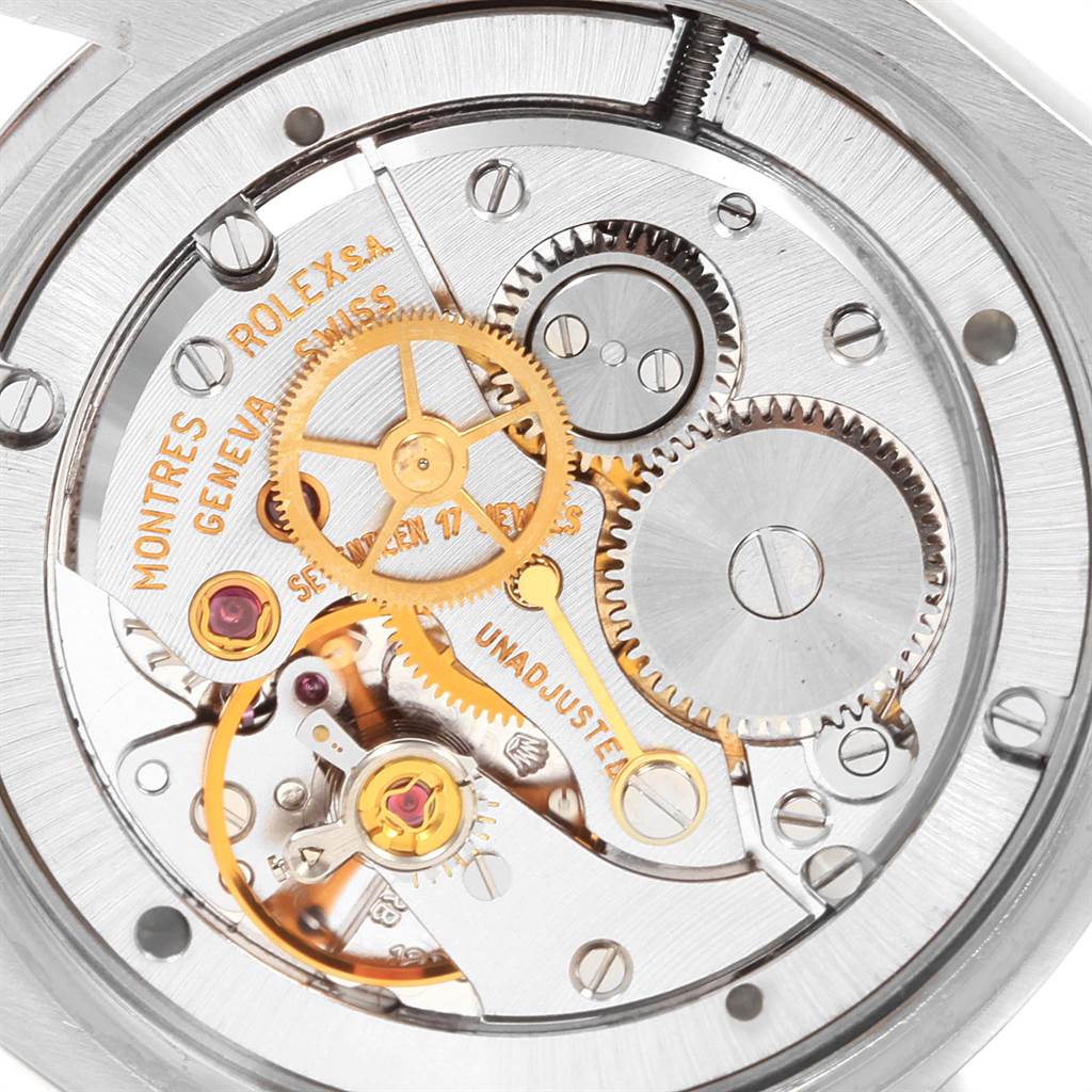 Close-up of the internal mechanical movements and gears of a Vintage Collection Rolex watch.