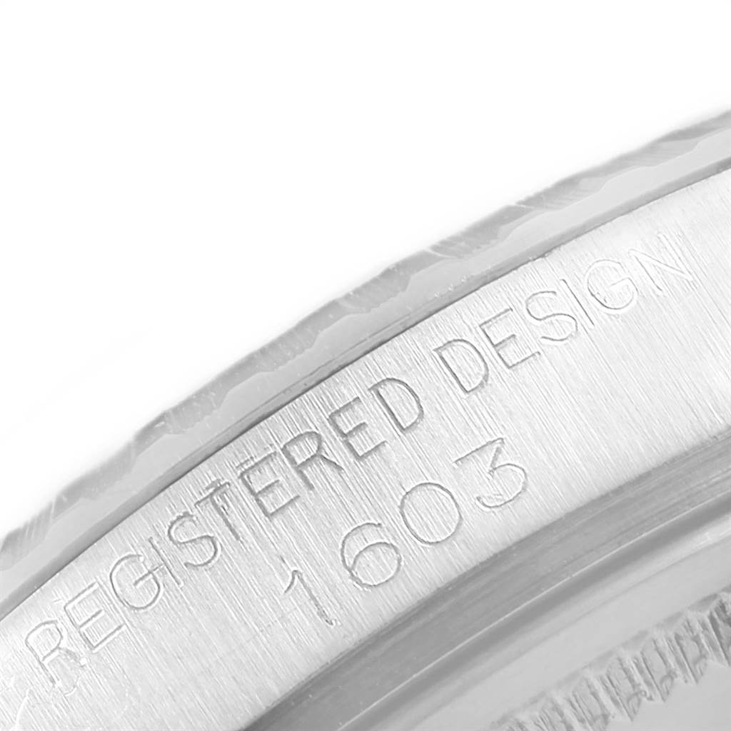 The image shows a close-up of the engraved model number "1603" on the bezel of a Rolex Vintage Collection 1603 Men's Stainless Steel Silver Dial 1603 Men's Stainless Steel Silver Dial watch.