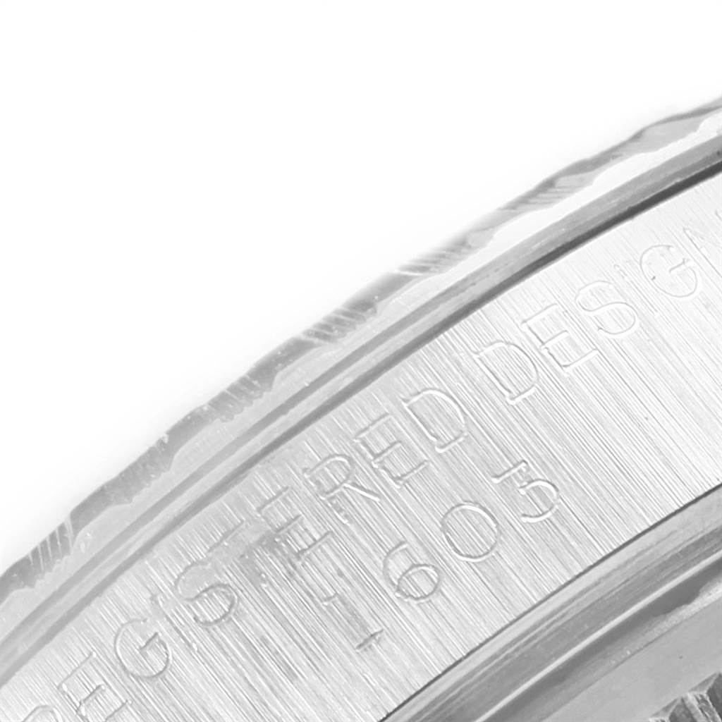 The image shows a close-up angle of the engraved inscription on the bezel of the Vintage Collection model by Rolex.