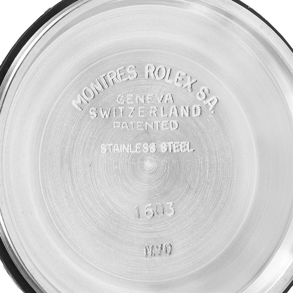 The image shows the inner side of the case back of a Rolex Vintage Collection 1603 Men's Stainless Steel Silver Dial 1603 Men's Stainless Steel Silver Dial model 1603, displaying inscriptions and model numbers.