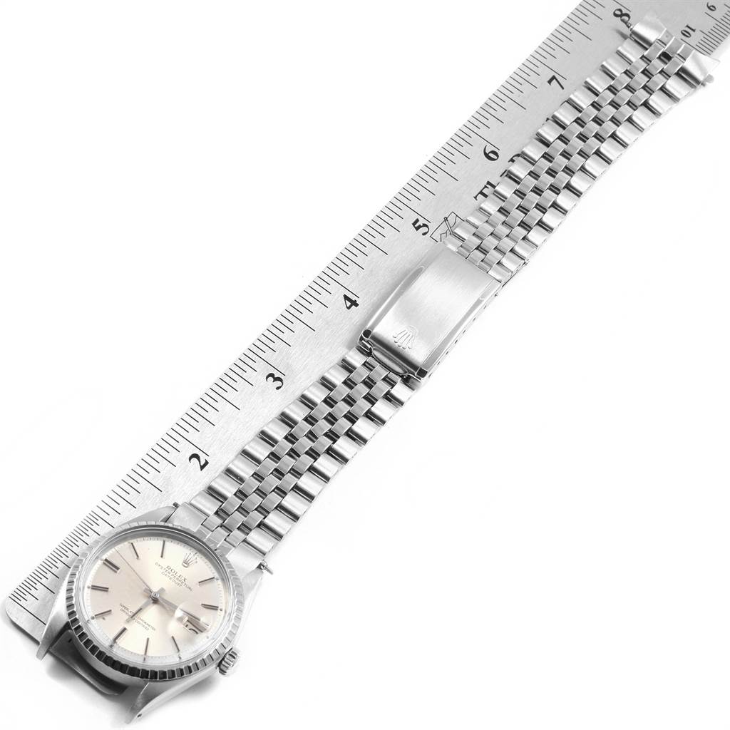 The image shows a flat-lay view of a Rolex Vintage Collection 1603 Men's Stainless Steel Silver Dial 1603 Men's Stainless Steel Silver Dial watch with its face, bracelet, and clasp, measured against a ruler.