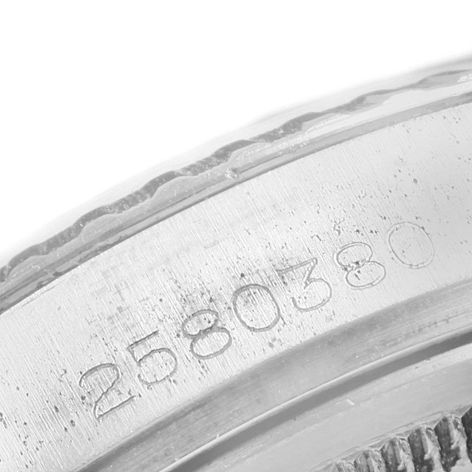 This image shows a close-up of the serial number engraved on the case of a Vintage Collection model by Rolex.