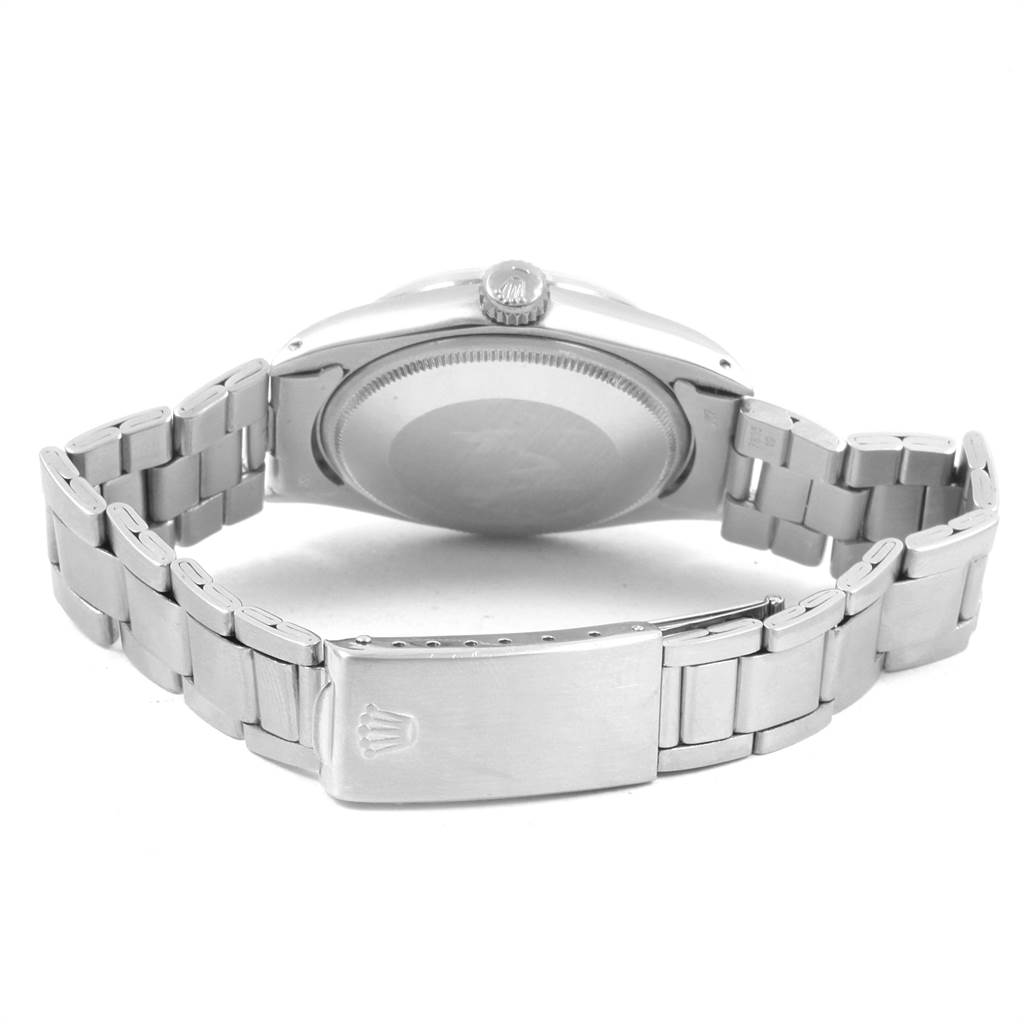 This image shows the back case and stainless steel bracelet of a Rolex Vintage Collection 1500 Men's Stainless Steel Silver Dial 1500 Men's Stainless Steel Silver Dial model.