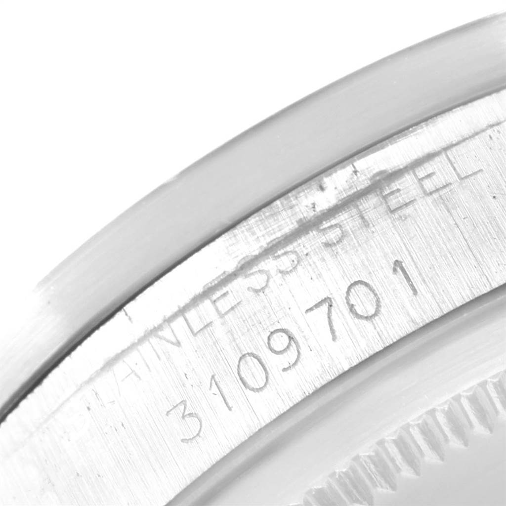 This image shows a close-up of the stainless steel bezel with engraving from a Rolex Vintage Collection 1501 Men's Stainless Steel Silver Dial 1501 Men's Stainless Steel Silver Dial watch.