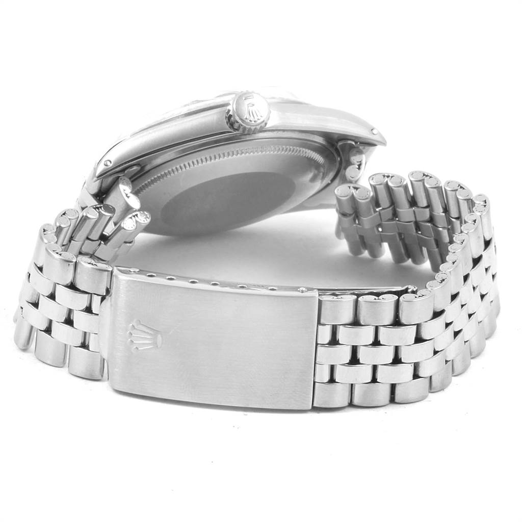 The image shows a side view of a Rolex Vintage Collection 1601 Men's Stainless Steel Silver Dial 1601 Men's Stainless Steel Silver Dial watch, focusing on the clasp, bracelet, and case back.