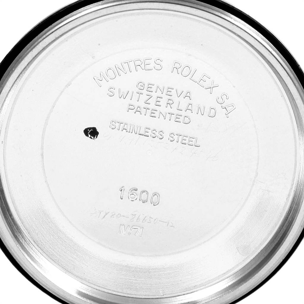 This image shows the inside of the back cover of a Rolex Vintage Collection 1601 Men's Stainless Steel Silver Dial 1601 Men's Stainless Steel Silver Dial model, engraved with the brand details.