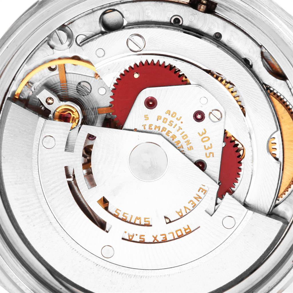 This image shows a close-up of the internal mechanical movement of a Rolex Vintage Collection 16014 Men's Stainless Steel Silver Dial 16014 Men's Stainless Steel Silver Dial watch, highlighting its gears and intricate details.
