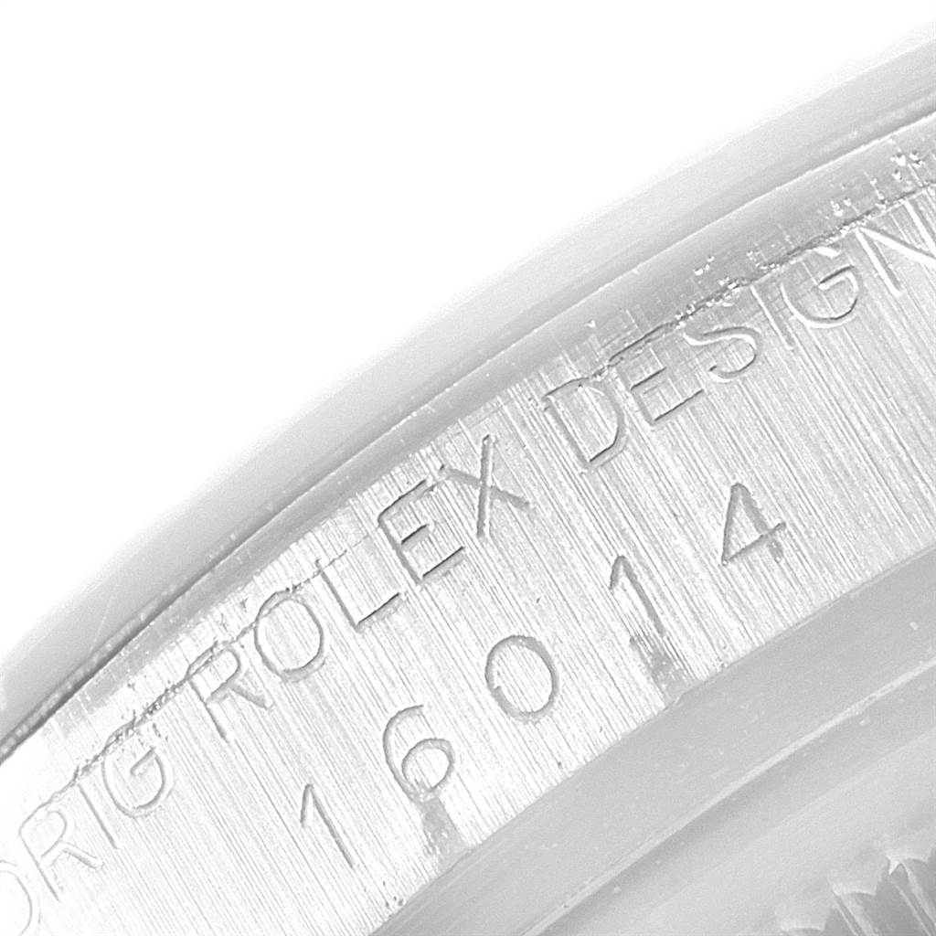 The image shows a close-up view of the case side with engraved text on the Rolex Vintage Collection 16014 Men's Stainless Steel Silver Dial 16014 Men's Stainless Steel Silver Dial model 16014.