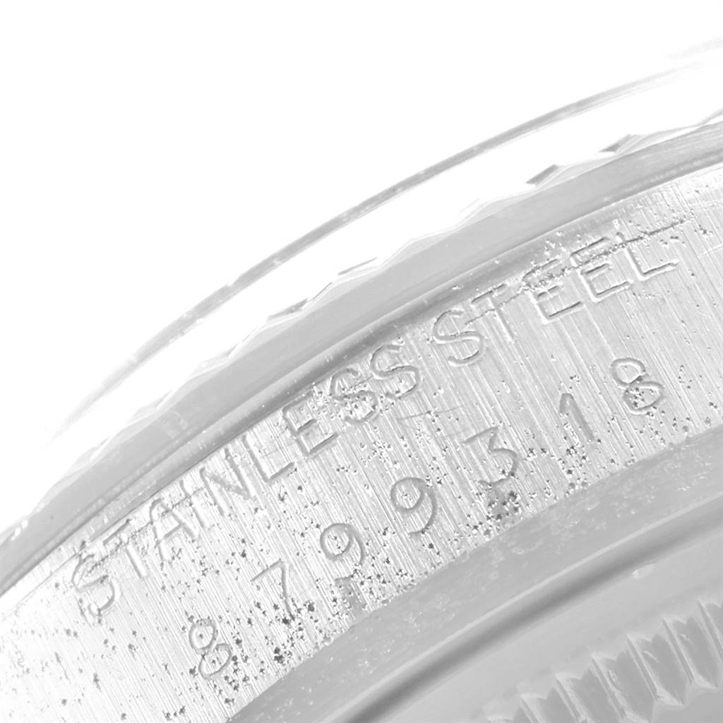 This close-up image shows the engraved details on the casing of a Rolex Vintage Collection 16014 Men's Stainless Steel Silver Dial 16014 Men's Stainless Steel Silver Dial watch.