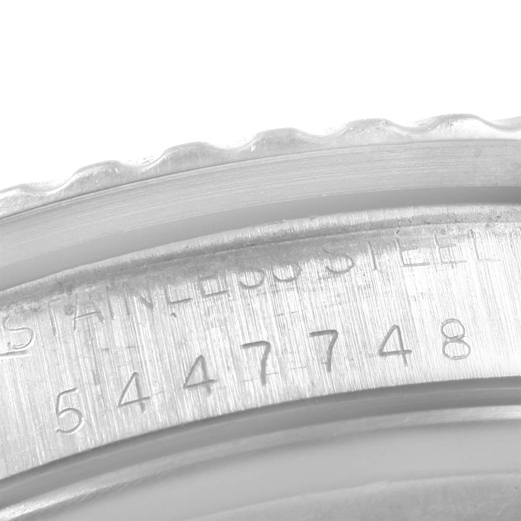 The image shows a macro shot of the serial number and part of the bezel on a Rolex Vintage Collection 1680 Men's Stainless Steel Black Dial 1680 Men's Stainless Steel Black Dial watch.