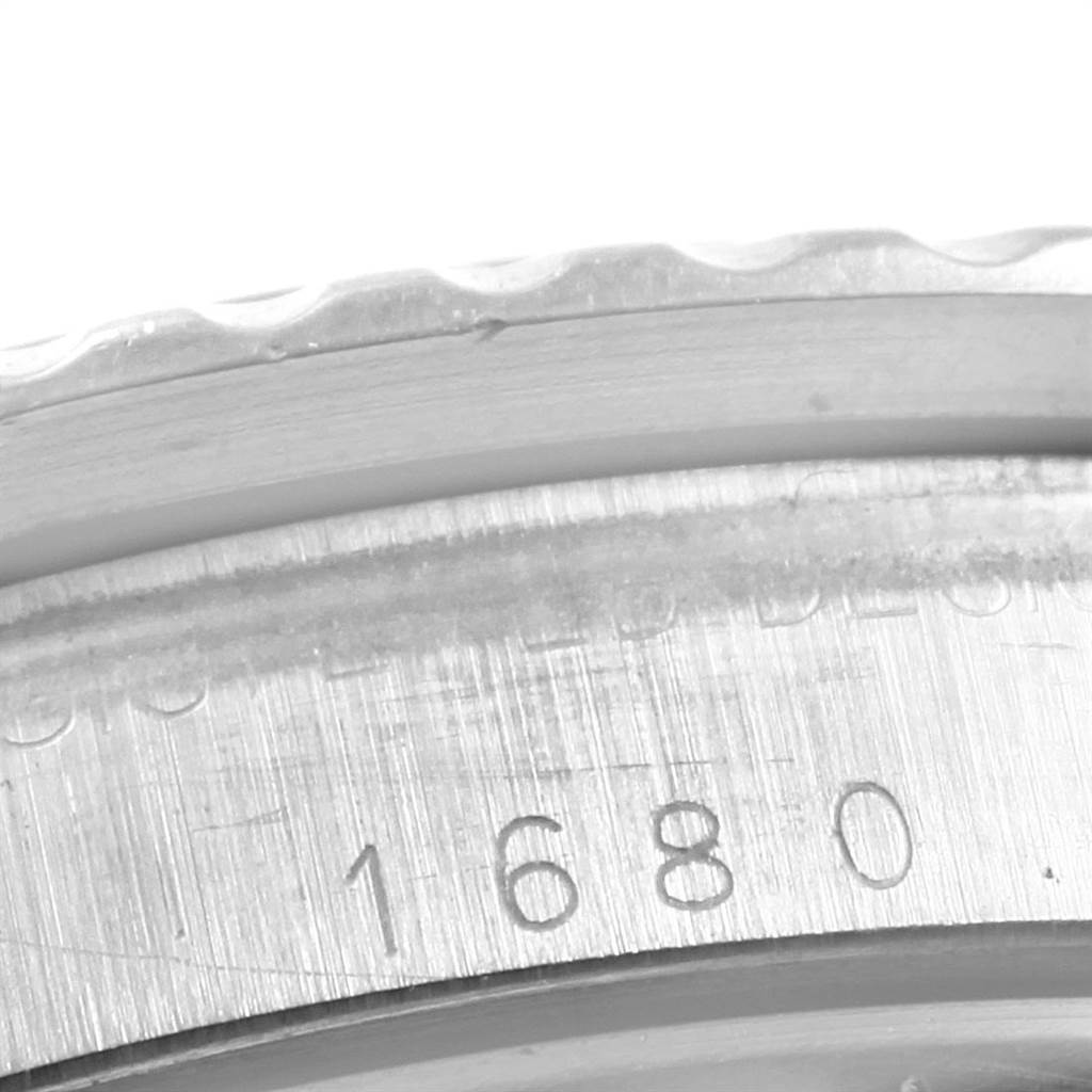 This image shows a close-up of the side of the Rolex Vintage Collection 1680 Men's Stainless Steel Black Dial 1680 Men's Stainless Steel Black Dial model 1680, highlighting its engraved model number.