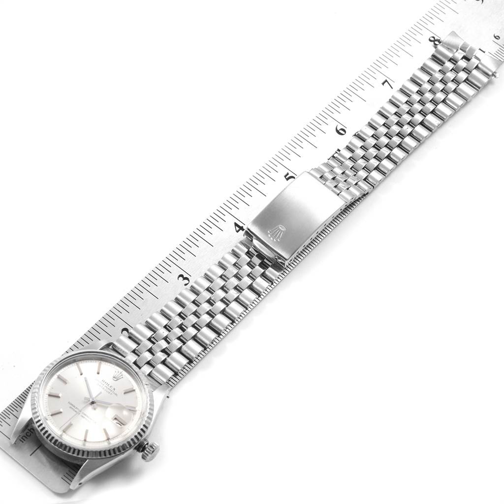 The image shows a Vintage Collection Rolex watch laid flat with a ruler, focusing on the entire band and watch face.