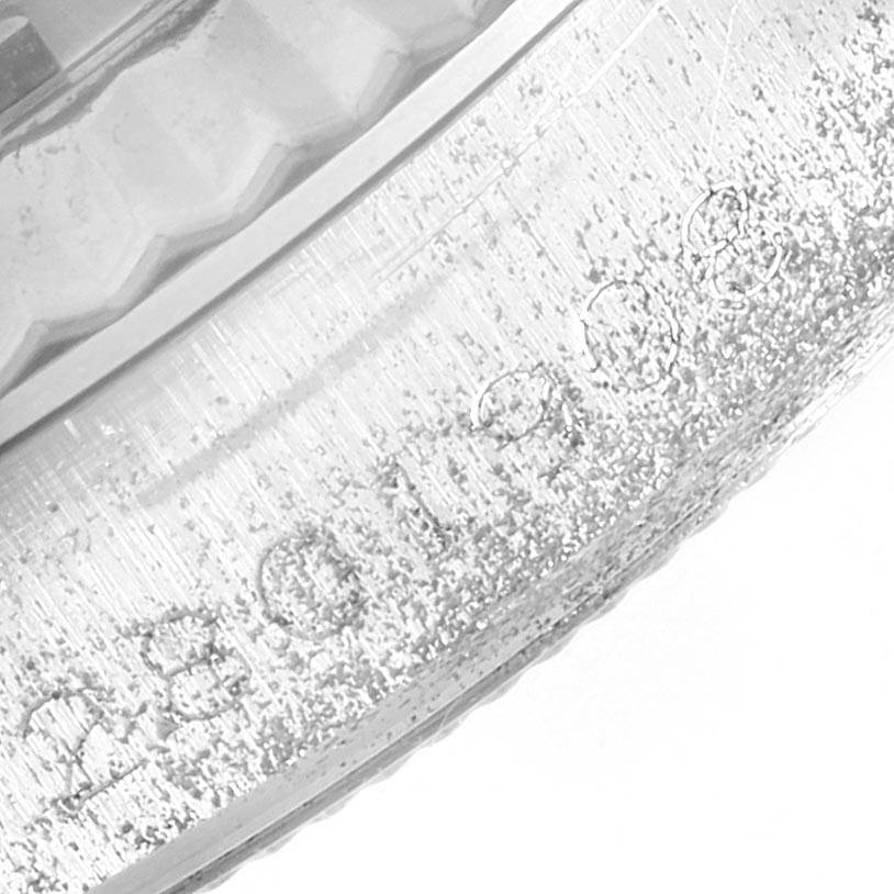 This close-up image shows the engraved bezel of the Rolex Vintage Collection 1601 Men's Stainless Steel Silver Dial 1601 Men's Stainless Steel Silver Dial watch.