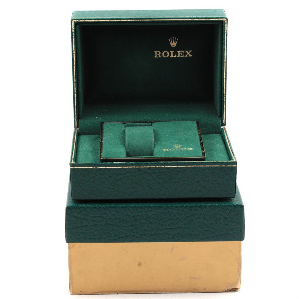 This image shows an open green Rolex watch box for a Vintage Collection model, showcasing the interior compartments.