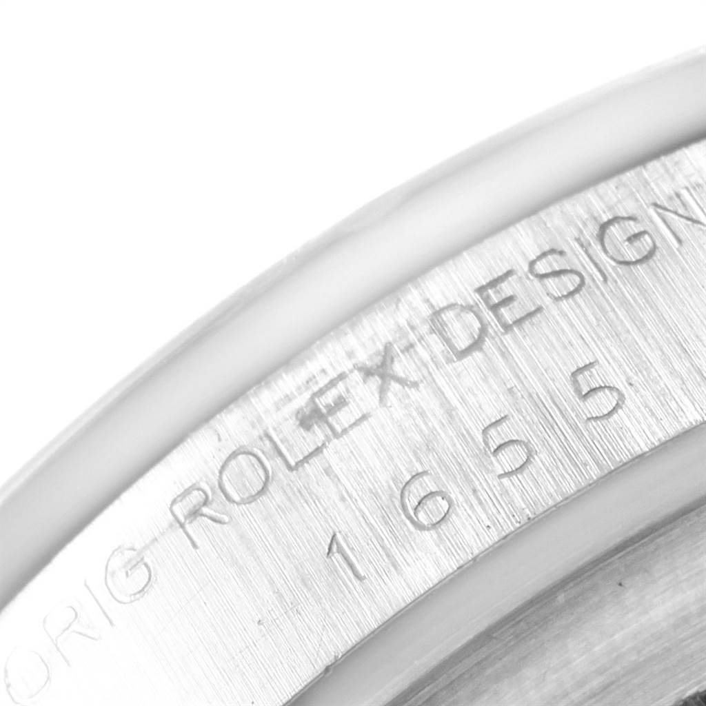 The image shows a close-up of the engraved outer rim of the case back of a Vintage Collection model by Rolex, numbered 1655.