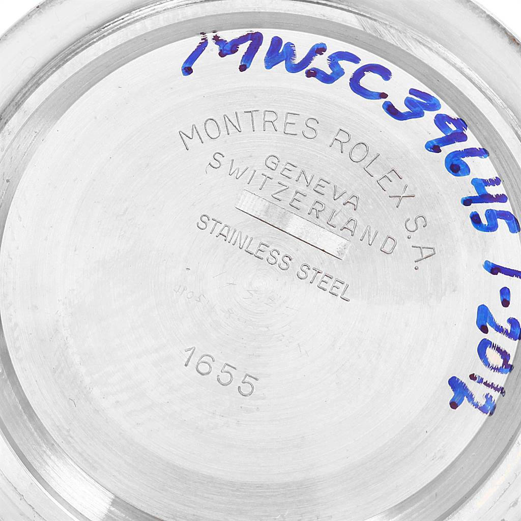 The image shows the stainless steel case back of a Vintage Collection model by Rolex from an overhead angle.