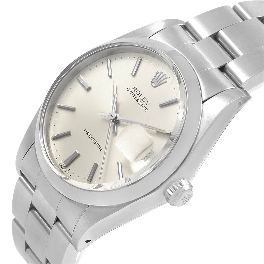 The image shows a Rolex Vintage Collection 6694 Men
s Stainless Steel Silver Dial 6694 Men
s Stainless Steel Silver Dial watch, angled from the side, displaying the face, crown, and partial stainless steel bracelet.