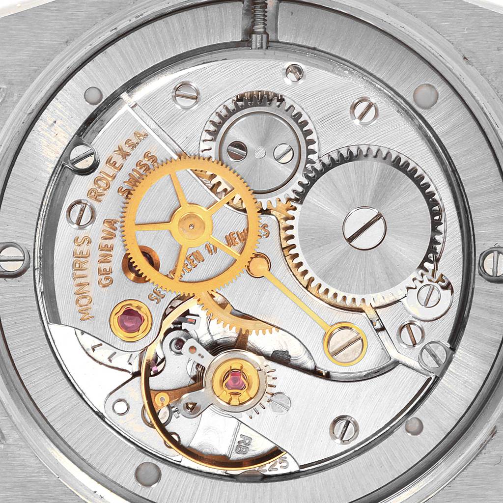 This image shows the intricate inner mechanism and gears of a Rolex Vintage Collection 6694 Men
s Stainless Steel Silver Dial 6694 Men
s Stainless Steel Silver Dial watch from a top-down angle.