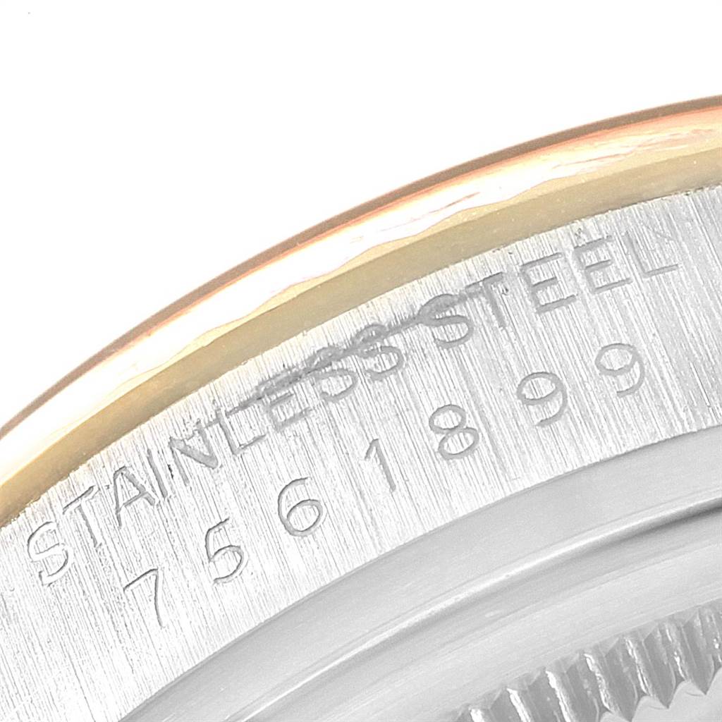 This image shows a close-up of the stainless steel casing with model and serial numbers for a Rolex Vintage Collection 16013 Men
s Stainless Steel Champagne Dial 16013 Men
s Stainless Steel Champagne Dial watch.