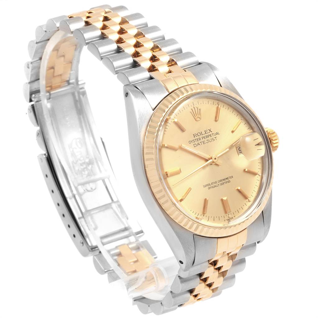 The image shows a side view of a Rolex Vintage Collection 16013 Men
s Stainless Steel Champagne Dial 16013 Men
s Stainless Steel Champagne Dial Datejust model, highlighting its gold and silver bracelet and gold dial.